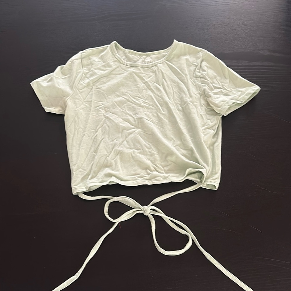 Green Hollister women’s baby tee size medium. Tie at the bottom.